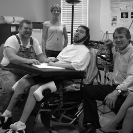 Erik Ramsey rests between experimental sessions with his father, Eddie Ramsey (left), Neural Signals Inc. founder Philip Kennedy, and lab technician Jess Bartels. Photos of Eric Ramsey and diagram courtesy of Frank Guenther